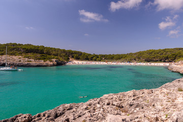 beautiful sea lagoon with beach and yachts