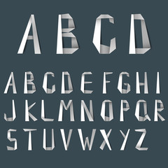 Big letters of alphabet from white folded paper template