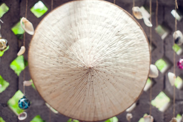 Asian bamboo hat on the wall background