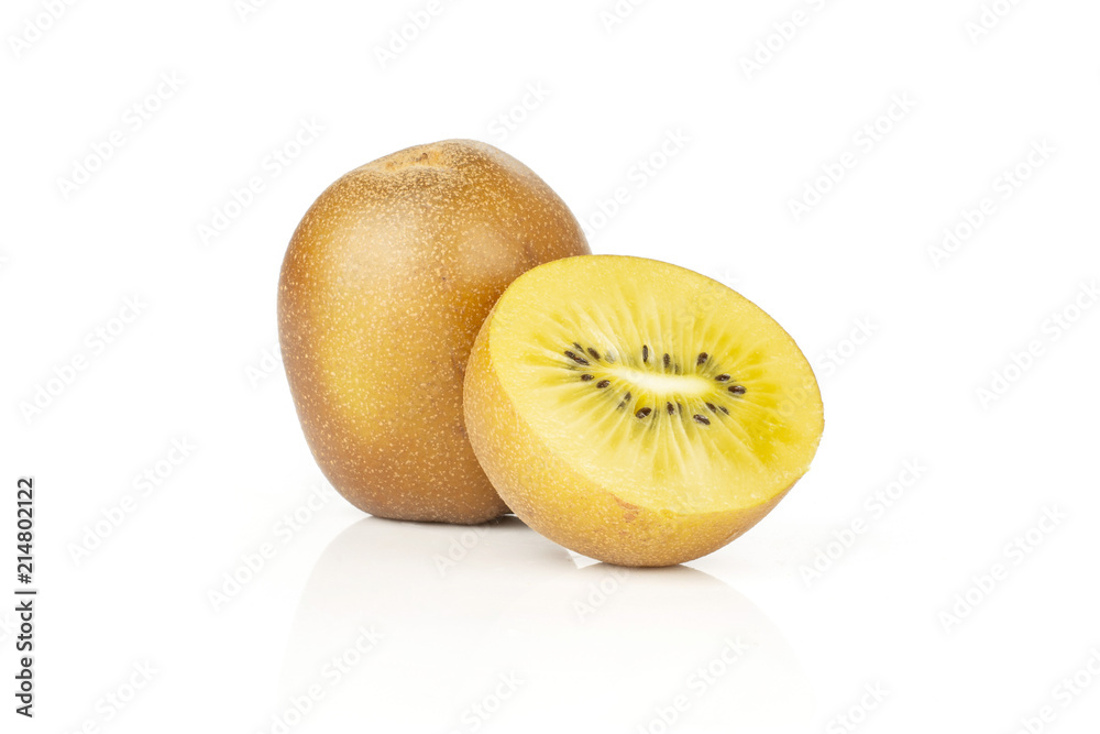 Wall mural Group of one whole one half of fresh golden brown kiwi fruit sungold variety isolated on white