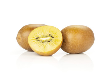 Group of two whole one half of fresh golden brown kiwi fruit sungold variety hairless isolated on white