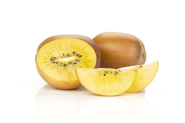 Group of two whole one half two slices of fresh golden brown kiwi fruit sungold variety isolated on white