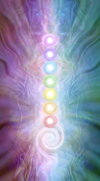 Kundalini Chakra masculine feminine diagram - seven chakras stacked with a kundalini spiral at the base on a purple pink blue green energy formation background
