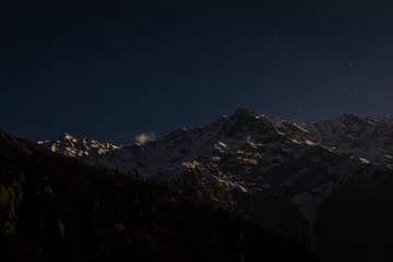 Fotobehang Amazing night view of mountains in snow at hill top, Snow Line, Mcleod ganj, Dharamsala, India. © matiplanas