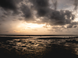 Sunset and cloudy beach.