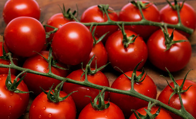 small tomatoes, sherry on a wooden board.