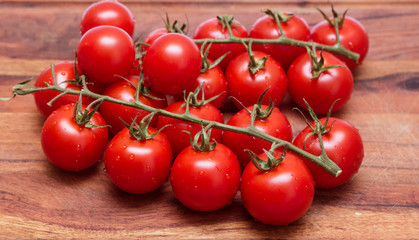small tomatoes, sherry on a wooden board.