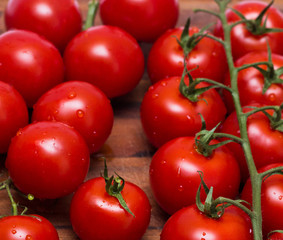 small tomatoes, sherry on a wooden board.