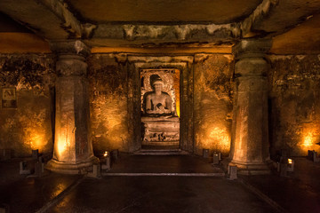 Sitting Buddha carved on the rocks, at Ajanta caves