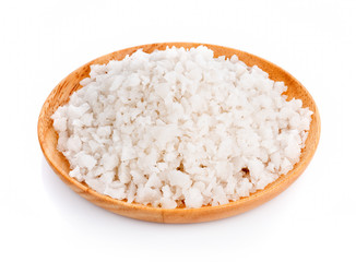 Sea salt in wooden bowl on white background