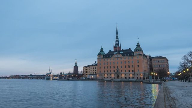 Stockholm city skyline day to night timelapse at Stockholm City Hall and Gamla Stan, Stockholm Sweden 4K Time Lapse