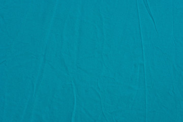 turquoise creased fabric background texture