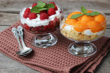 Dessert cups of Pecheneg, cottage cheese, raspberry, and apricot