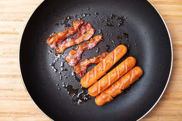 Bacon and sausage in a pan