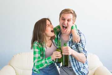 Soccer world cup concept - Young friends drink beer and cheering for football