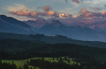 Mountain peaks lit by the rising sun. Tatra Mountains , Poland