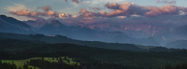 Fototapeta na wymiar Mountain peaks lit by the rising sun. Tatra Mountains , Poland