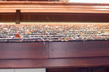 Roofs and balconies are made of old brown wood.