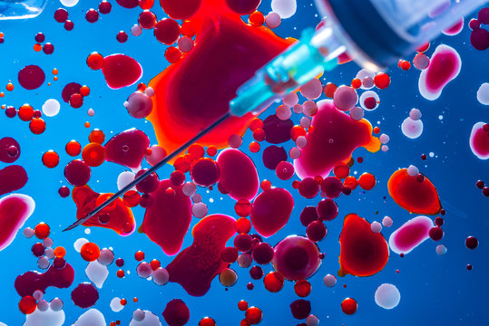 Red bubbles of blood cells on blue background. Abstraction of medicine. Micro processes and diseases in the human body