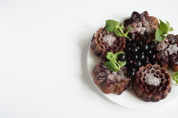 muffin and currant berries on white background