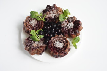 muffin and currant berries on white background