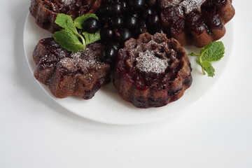muffin and currant berries on white background