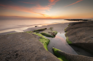 view of beautiful sunset seascape at Kudat, Sabah Malaysia. soft focus due to long expose.