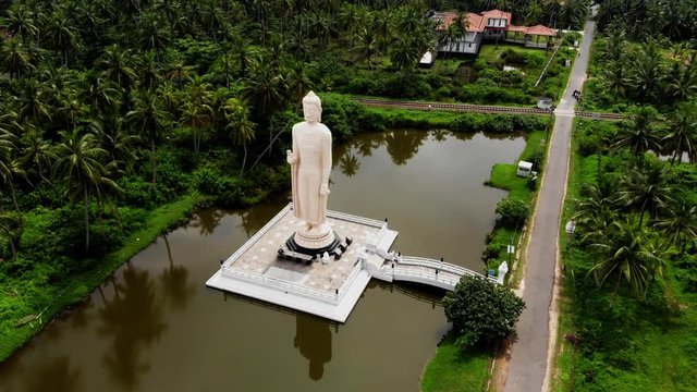 Aerial view from shot Peraliya Buddha Statue, the Tsunami Memorial in Hikkaduwa, Sri Lanka 4k