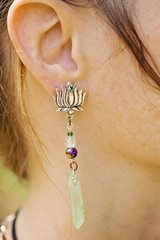 Woman wearing decorative long earrings