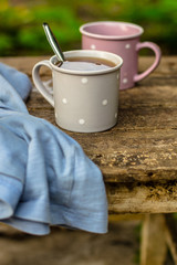 Cups with a hot drink (tea or coffee) in your hands . food drink background