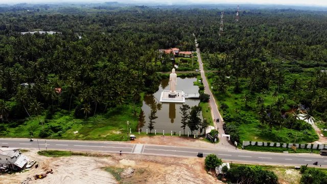 Aerial view from shot Peraliya Buddha Statue, the Tsunami Memorial in Hikkaduwa, Sri Lanka 4k