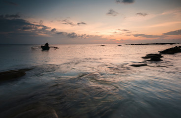 view of beautiful sunset seascape at Kudat, Sabah Malaysia. soft focus due to long expose.