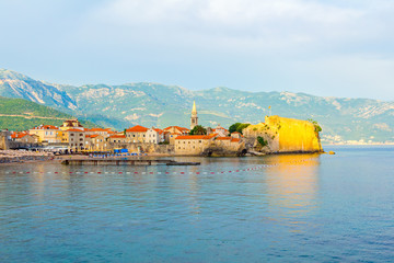 Fototapeta na wymiar View to the old city Budva on Adriatic sea coastline at Montenegro. summer seascape background