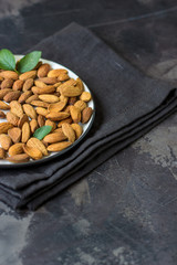 Almond nuts on a dark background. Organic raw almond