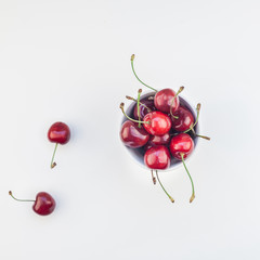Naklejka na ściany i meble Fresh ripe cherry in a bowl