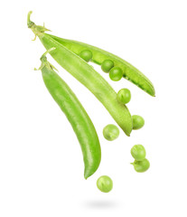 Uncovered pea pod in the air isolated on a white background