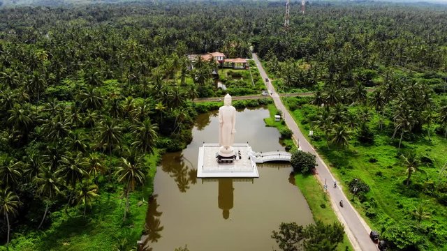 Aerial view from shot Peraliya Buddha Statue, the Tsunami Memorial in Hikkaduwa, Sri Lanka 4k