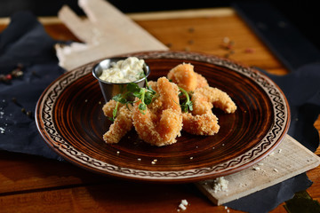 shrimps tempura (battered fried shrimps) on wooden table