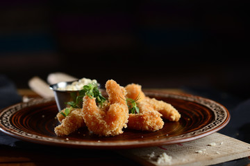 shrimps tempura (battered fried shrimps) on wooden table