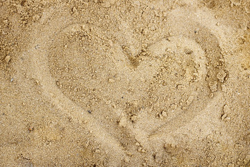 Heart painted on the beach in the sand