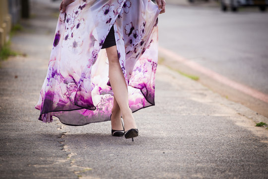 Close up image of a flower print dress blowing softly in the wind