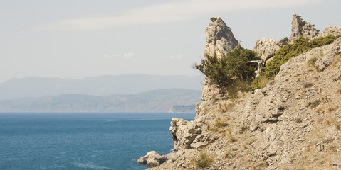 Picturesque rocks of a pointed shape on the black sea Bay.Crimea.