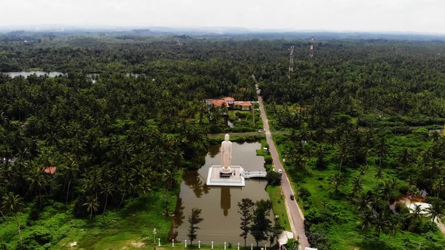 Aerial view from shot Peraliya Buddha Statue, the Tsunami Memorial in Hikkaduwa, Sri Lanka 4k