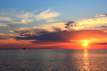Naklejka na ściany i meble gold sunset, blue sea
