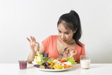  Woman does not like vegetable. Unhappy woman  does not like healthy food, Emotional face.