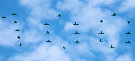 Fototapeta premium The largest ever formation of Royal Air Force Typhoons have spelt out 100 in the skies above Buckingham Palace to mark the centenary of the service. A total of 22 of the fighter jets took part 
