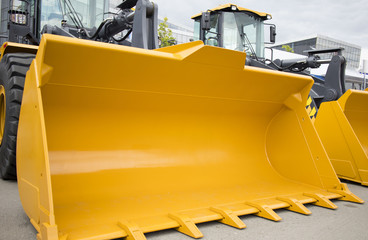 excavator with large yellow bucket