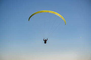 Parachutist Jumper in the blue sky