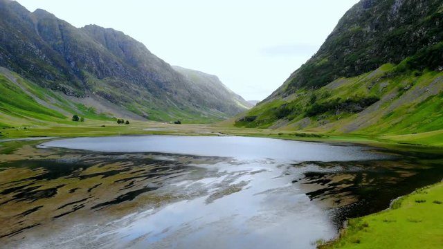 Flight over the awesome landscape of Glencoe in the Highlands of Scotland