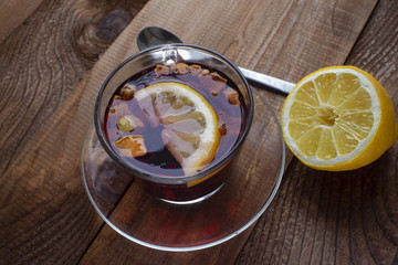 morning brewed in a cup of fruity red tea with lemon on top